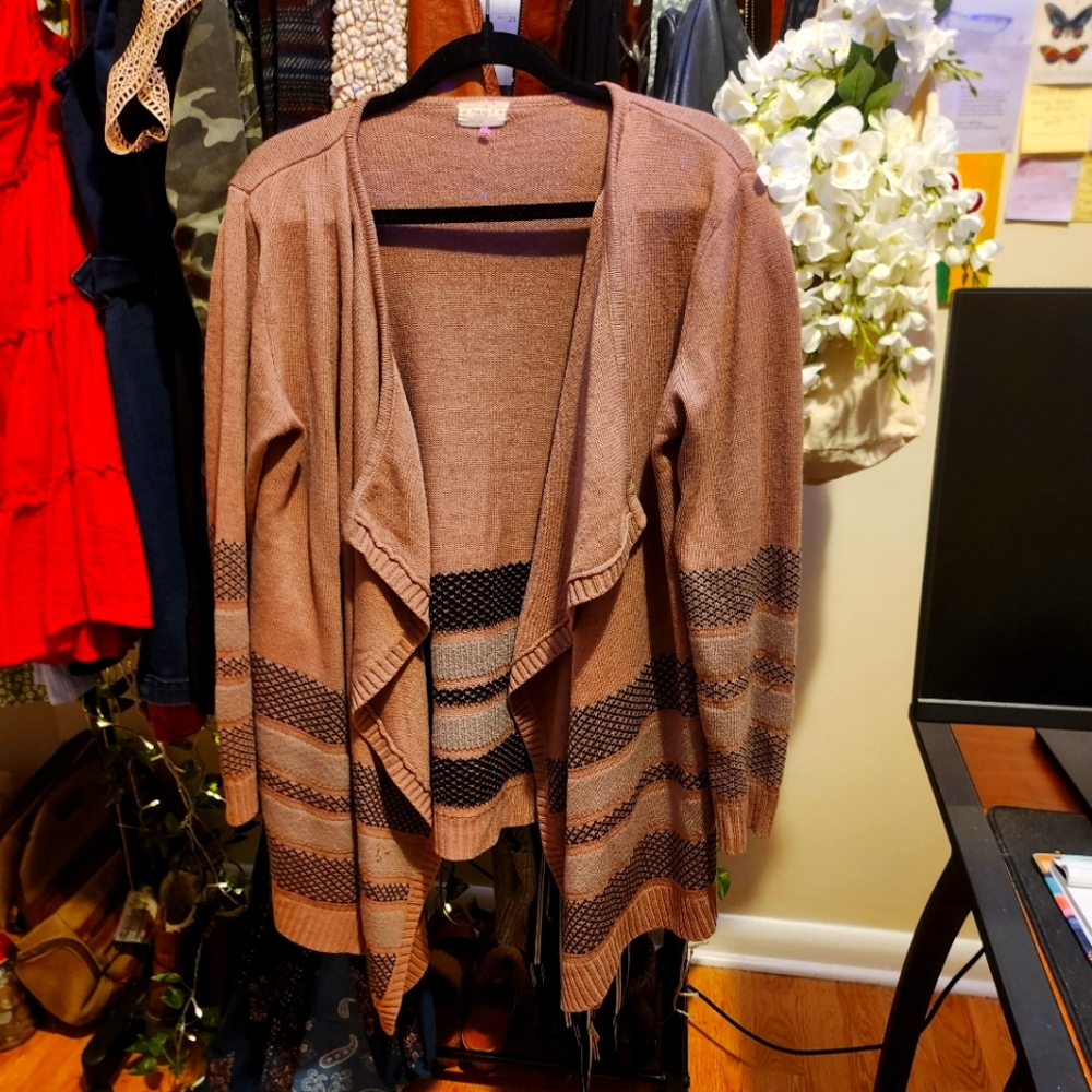 A mauve colored cardigan